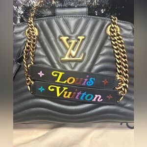 Limited edition authentic Louis Vuitton chain handbag.